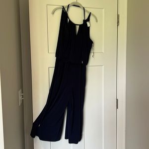 Navy blue polyester pants suit.
